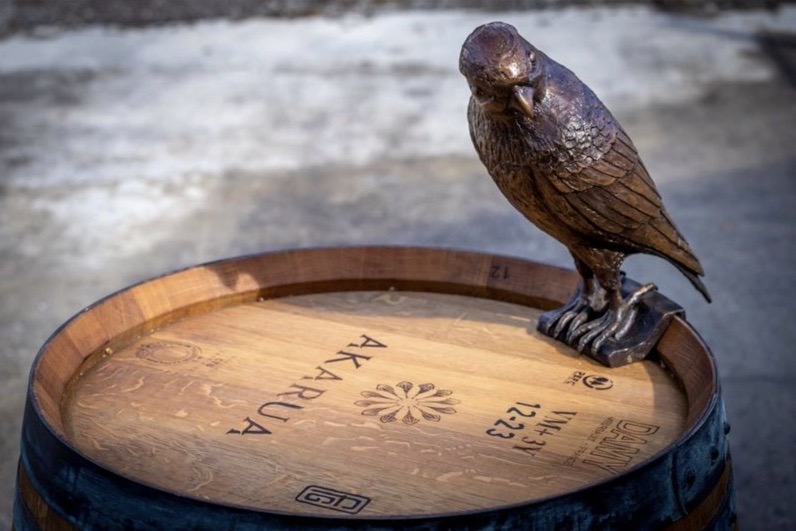 The Sentinal bronze sculpture on a wine barrel detail of falcon